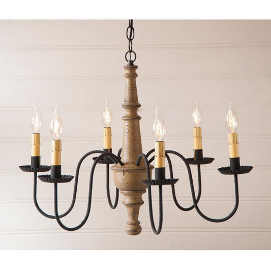Wooden chandelier with six candle-style lights on a beige background