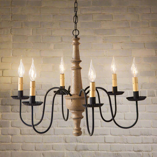 Wooden chandelier with six candle-style lights on a beige background