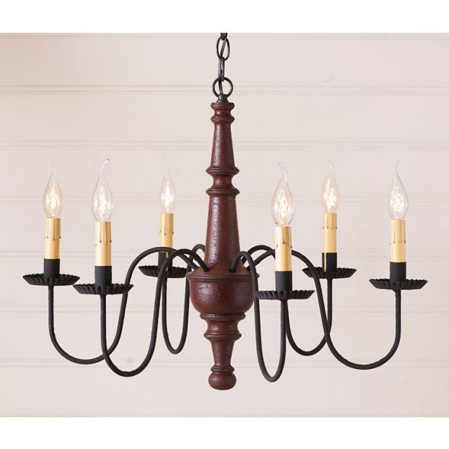 Chandelier with wooden central column and candle-style lights on a plain background