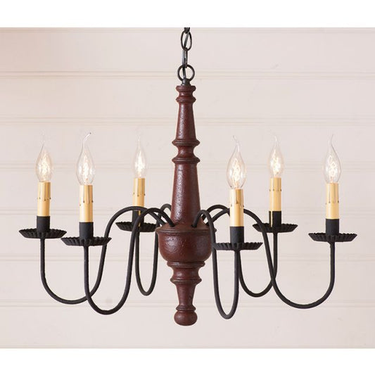 Chandelier with wooden central column and candle-style lights on a plain background