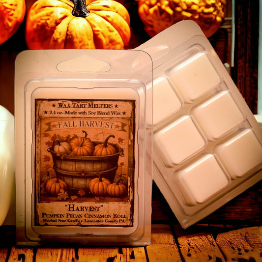 Clear clam shell packaging of wax melts with artwork of a barrel of pumpkins