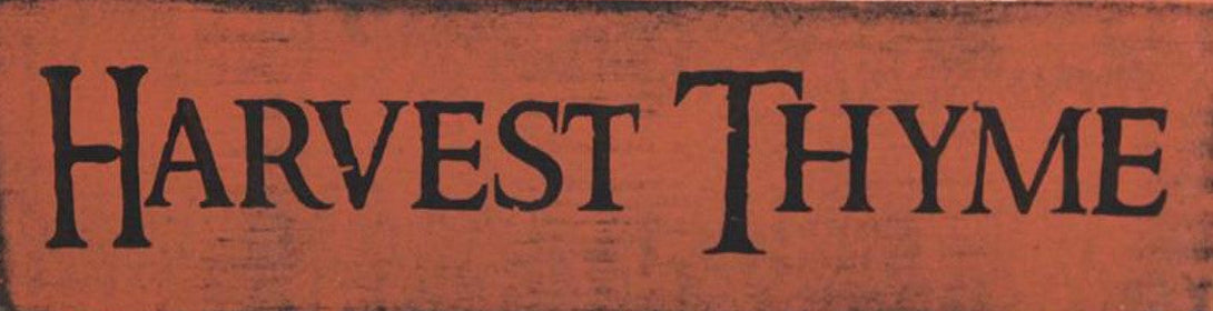 Wooden sign with 'Harvest Thyme' text on a orange background