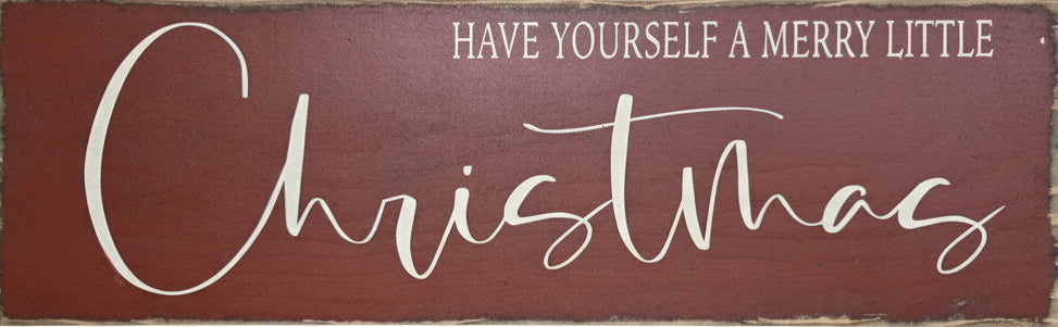 Wooden sign with 'Have Yourself a Merry Little Christmas' text on a red background