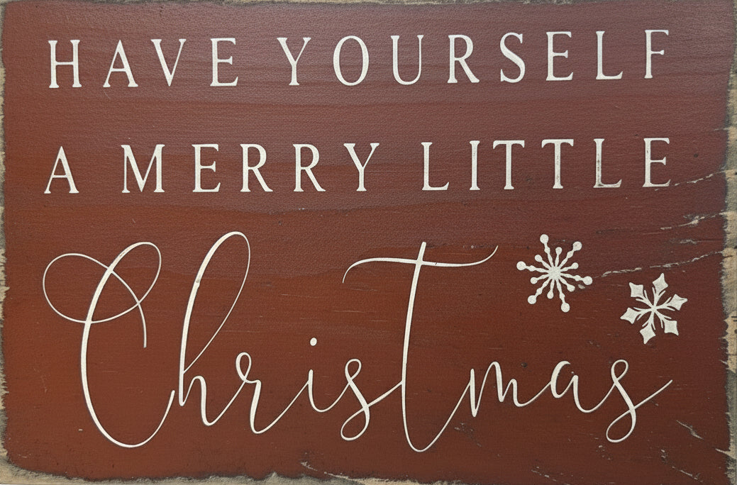 Wooden sign with 'Have Yourself a Merry Little Christmas' text on a brown background