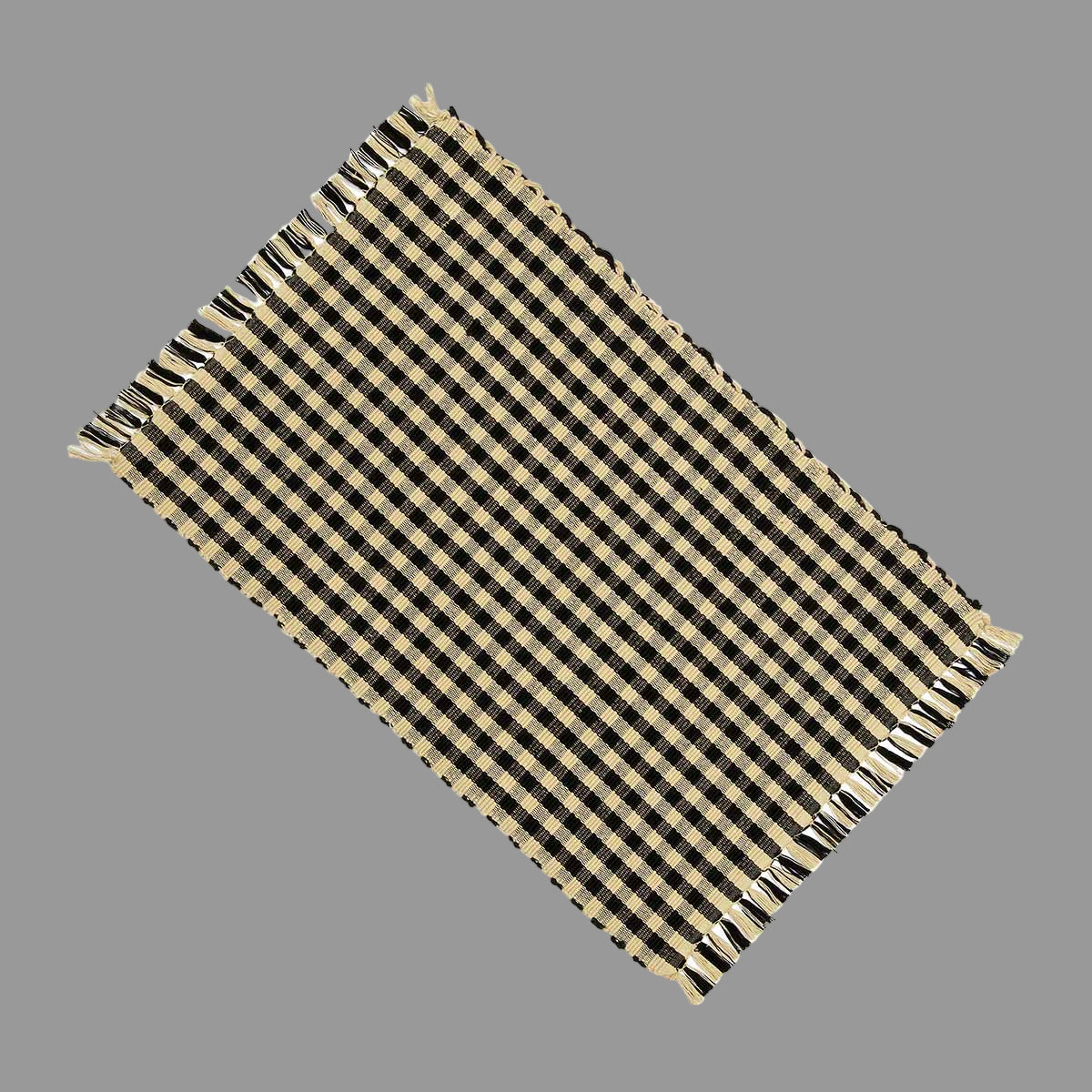 A black and beige checkered placemat on a white background