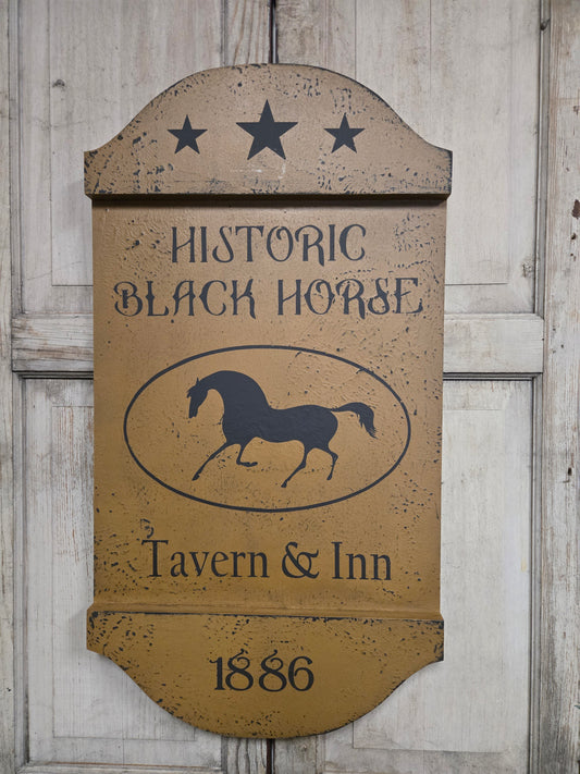 Wooden sign for Historic Black Horse Tavern & Inn with a horse logo and year 1886.