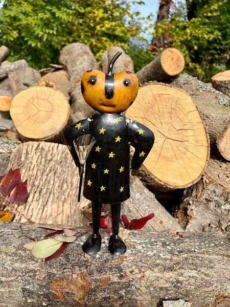Wooden bee figurine with star patterns on a log pile background