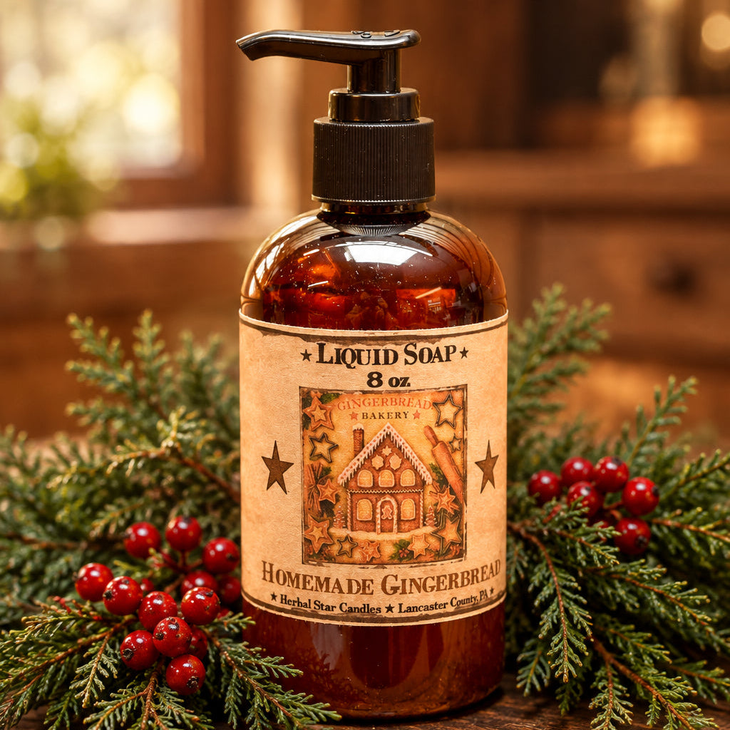 An amber glass pump bottle of liquid soap with a black dispenser and a vintage-style gingerbread label, set on a wooden surface with holiday lights and snow in the background.