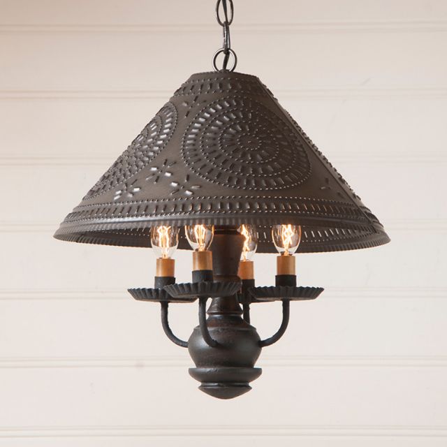 Decorative pendant light with intricate design on a neutral background