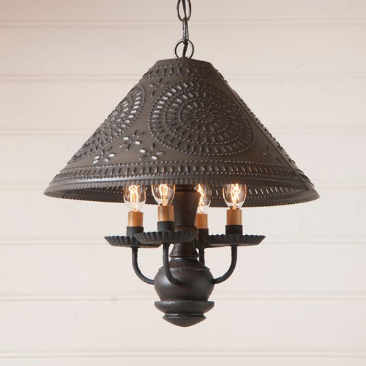 Decorative pendant light with intricate design on a neutral background