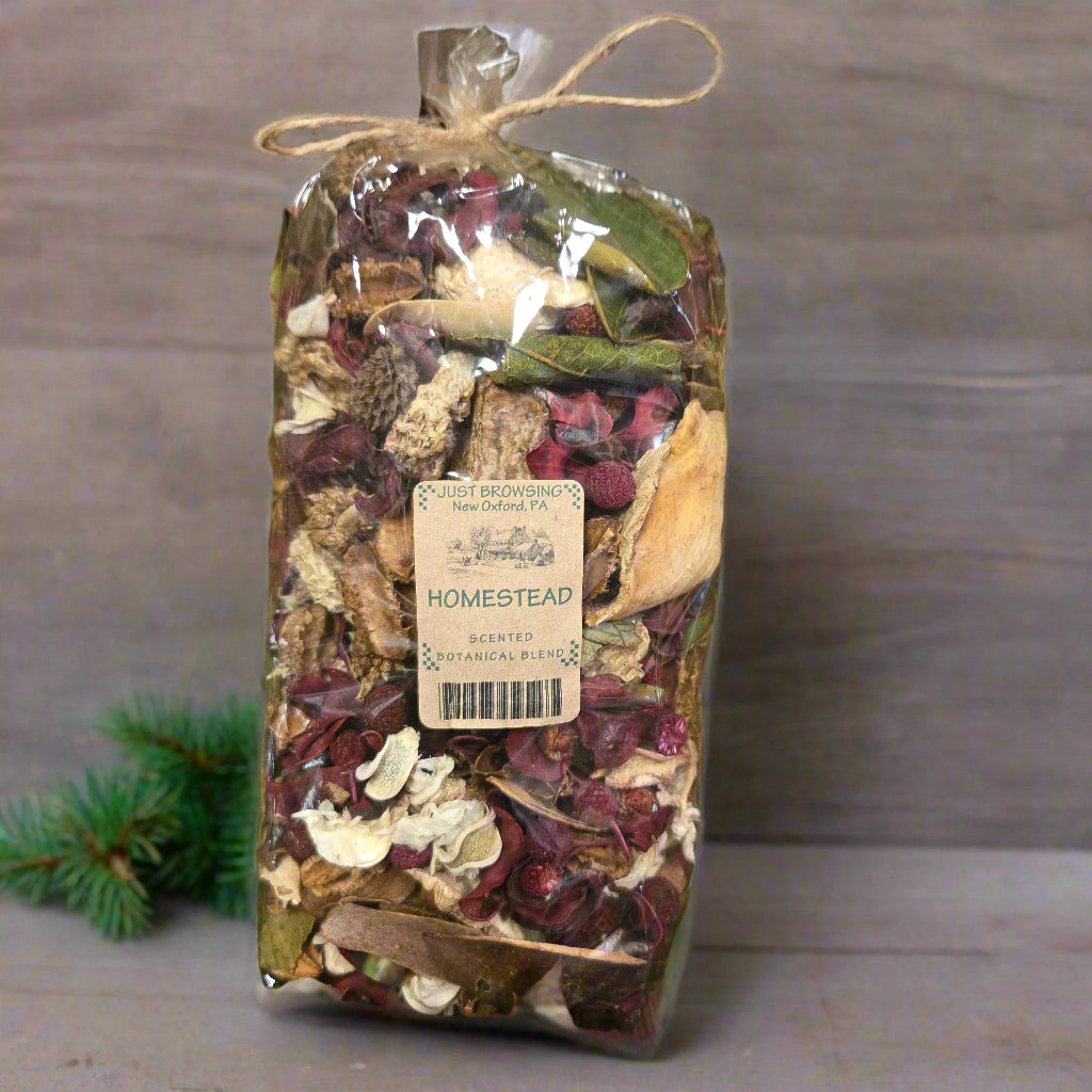 Packaged herbal mix with a label on a green leafy background