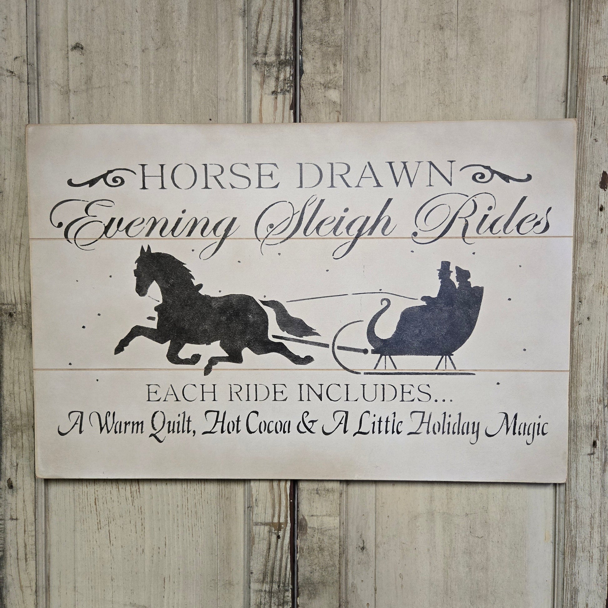 Weathered sign with horse and sleigh with some text