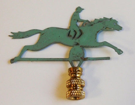 A verdigris lamp finial in the shape of a horse and rider, with a green copper body and gold-colored accents.