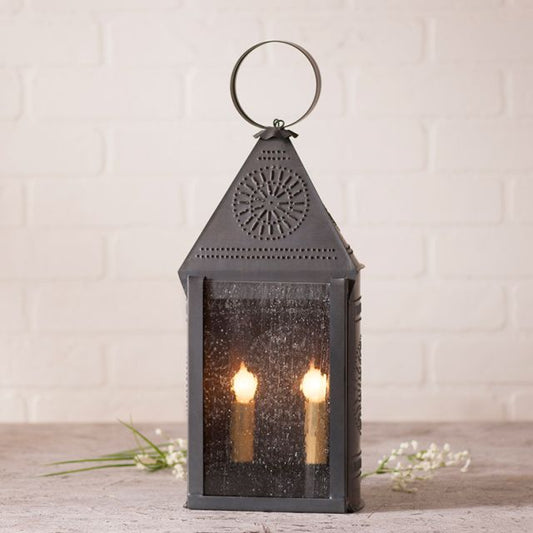 Decorative lantern with candles inside on a wooden surface with a light background