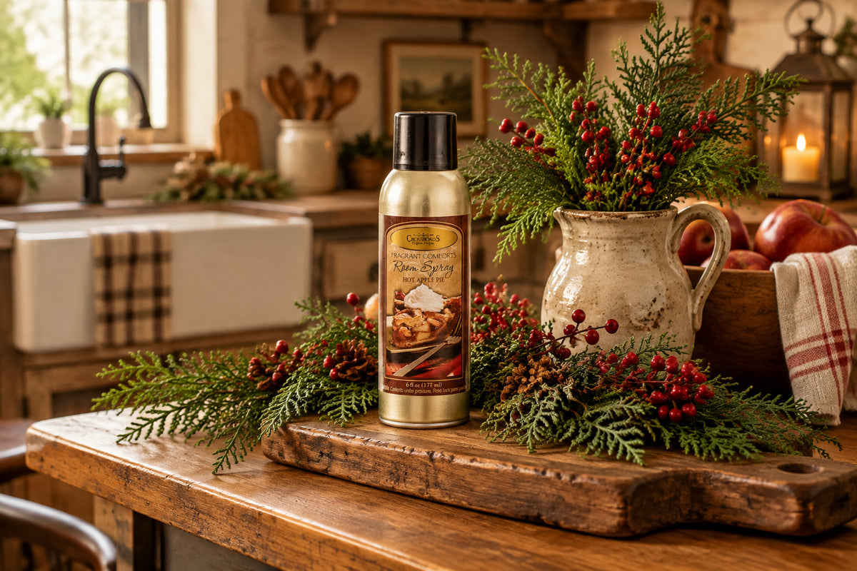 Room spray bottle with a label featuring a hot apple pie illustration on a white background