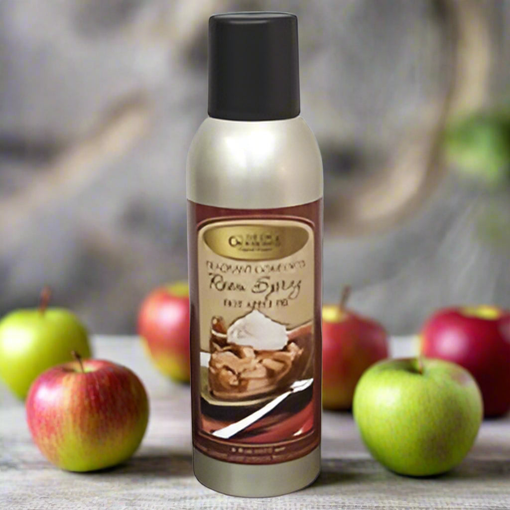 A bottle of Hot Apple Pie Room Spray by Crown Bay, featuring an image of a baked apple pie on the label.