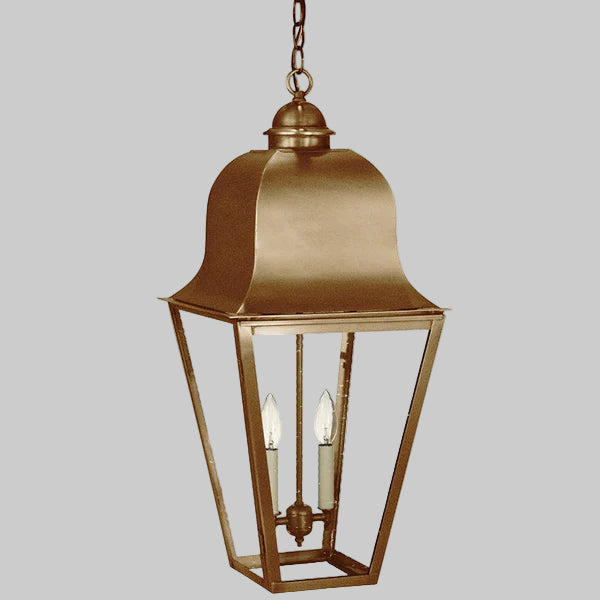 Bronze hanging lantern with two candle-like lights on a gray background