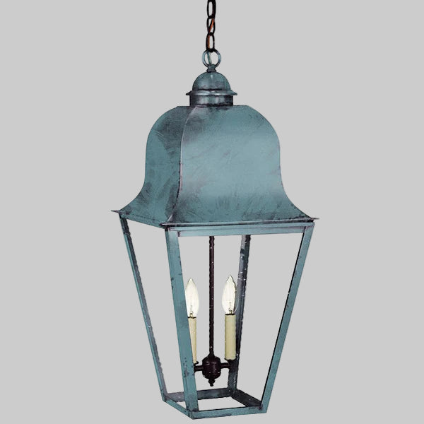 Vintage-style hanging lantern with a metallic finish on a gray background