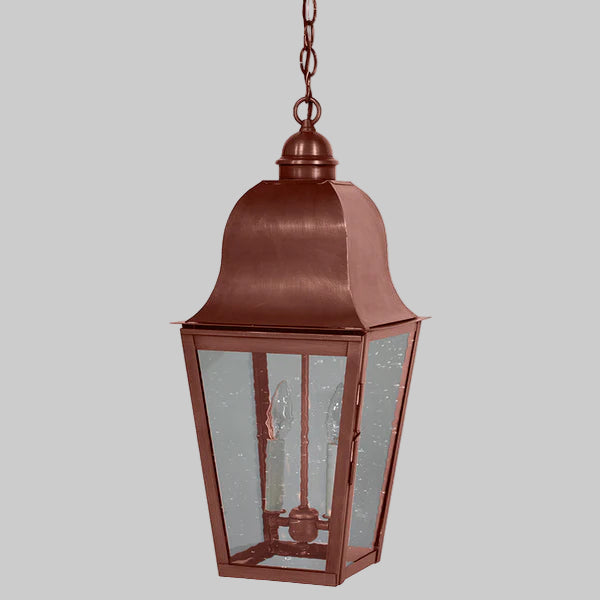 Copper outdoor hanging lantern on a gray background