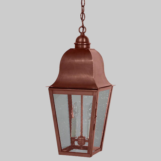 Copper outdoor hanging lantern on a gray background