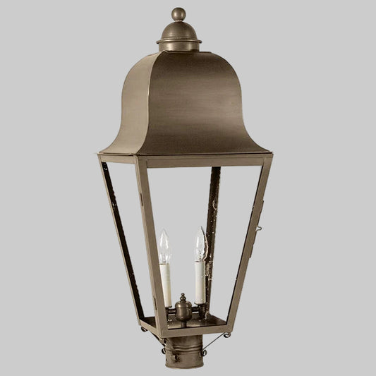 Bronze outdoor lantern with clear glass on a gray background