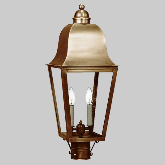 Bronze outdoor lantern with clear glass on a gray background