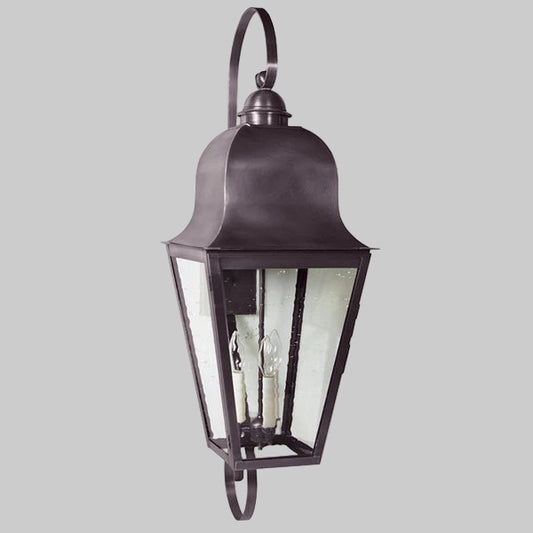 Traditional outdoor wall light fixture on a gray background
