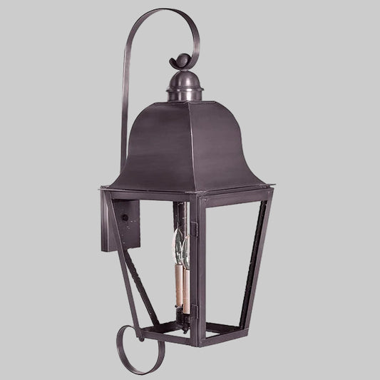 Decorative outdoor lantern with metal frame on a gray background