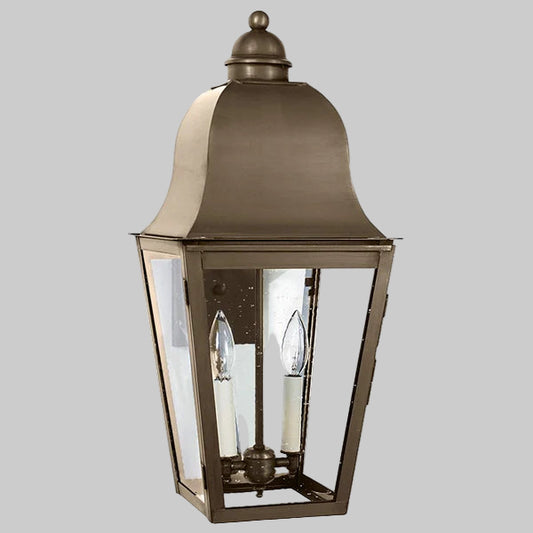 Bronze outdoor lantern with clear glass on a gray background