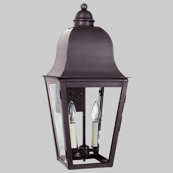 Traditional outdoor wall light fixture on a gray background