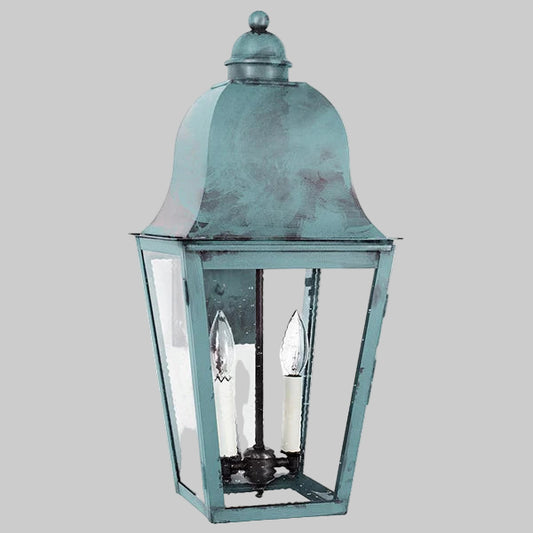 Vintage-style lantern with a metallic finish on a gray background