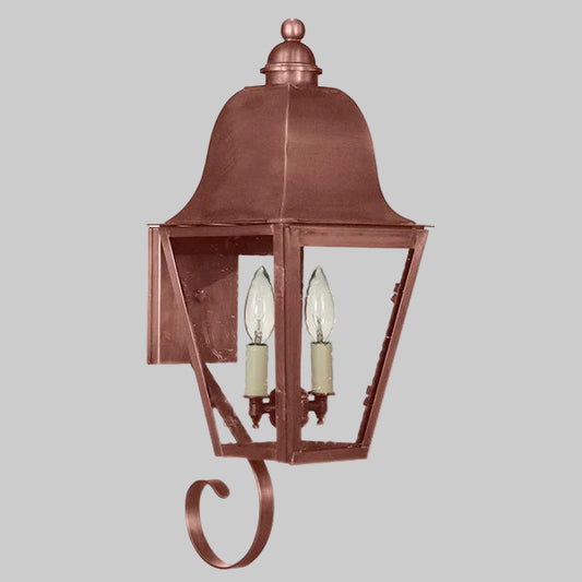 Copper outdoor wall light fixture on a gray background