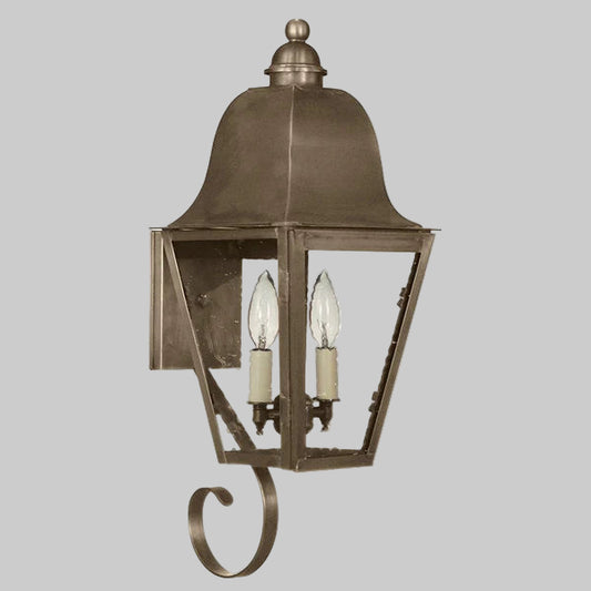Bronze outdoor wall light fixture on a gray background