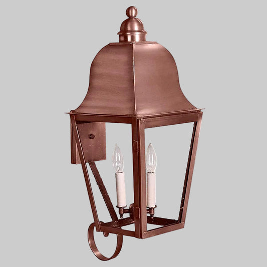 Copper outdoor wall light fixture on a gray background