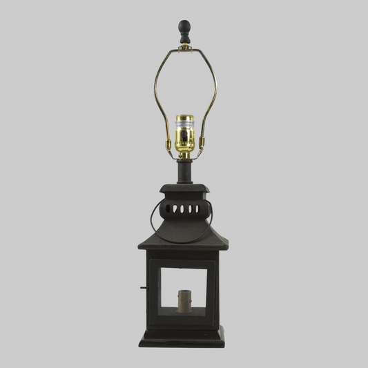 A black iron lantern lamp with a glass shade and a red night light inside, featuring a 3-way switch.