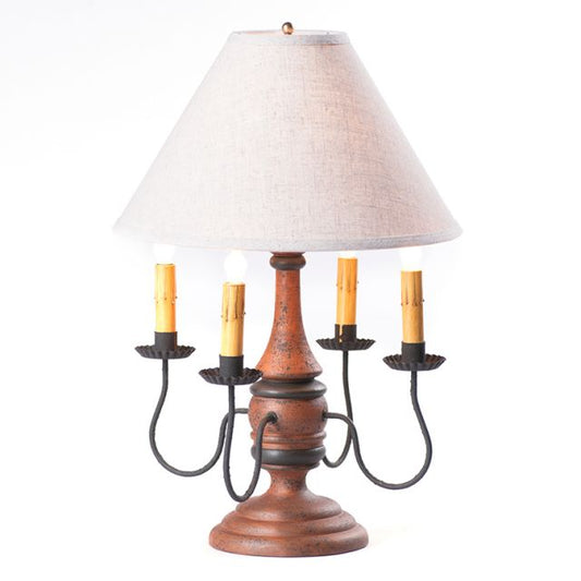 Decorative table lamp with wooden base and white shade on a white background