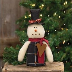 Primitive snowman doll with top hat and rusty star