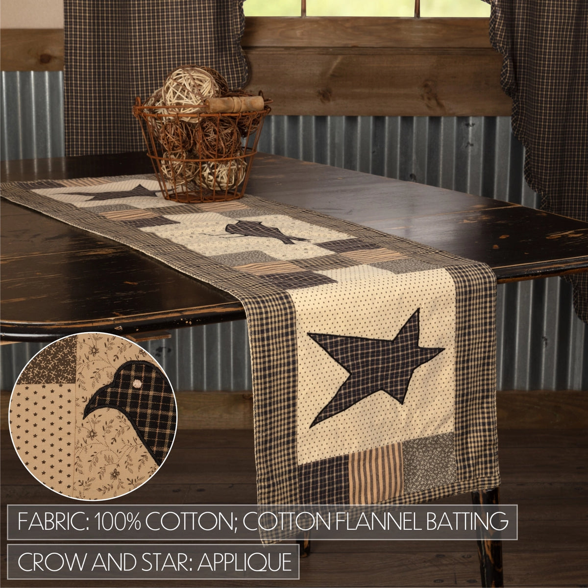 A rustic table runner with a patchwork quilt design featuring cow and star applique, displayed on a dark wooden table in a barn-style room. A circular inset shows a close-up of the fabric pattern.