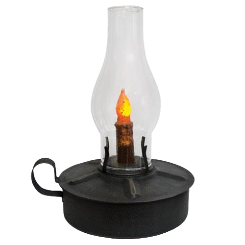 Black oil lamp with clear glass chimney on a white background