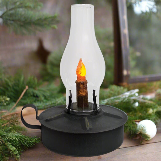 A black kitchen lantern with a glass chimney and a metal handle, featuring a battery-operated LED candle inside.