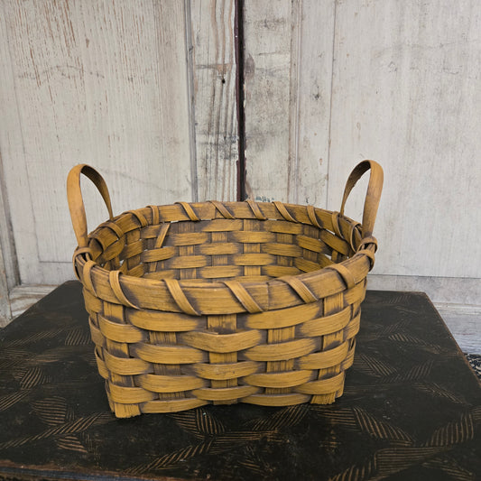 Woven basket on a textured surface