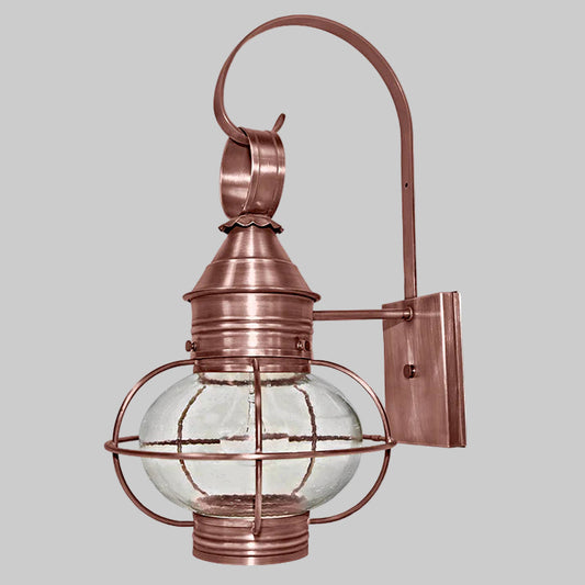 Copper outdoor wall light fixture with clear glass shade on a white background