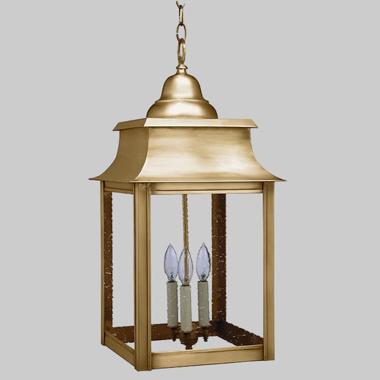 Brass hanging lantern with two candle-like lights on a white background