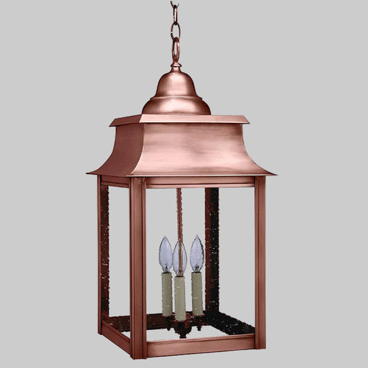 Copper hanging lantern with glass shades on a white background