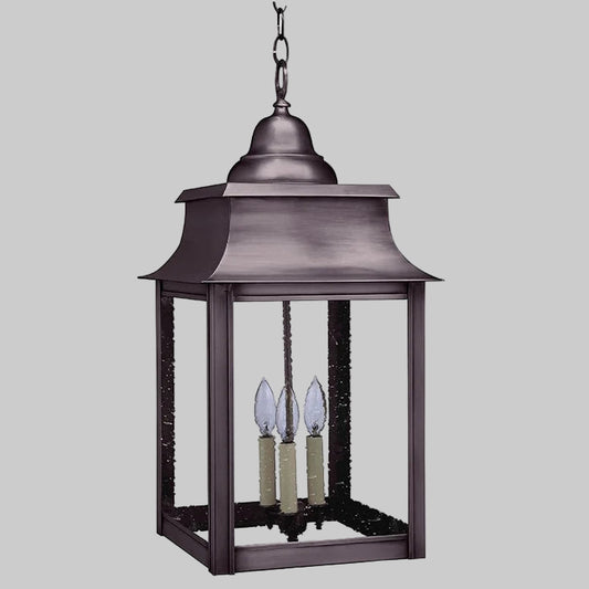 Decorative hanging lantern with three candle-like lights on a white background