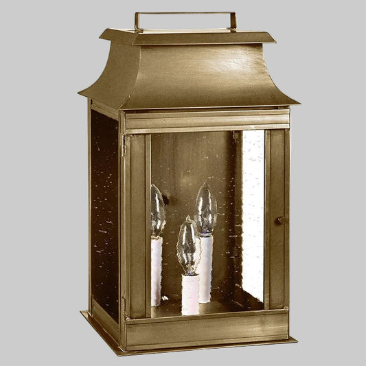 Bronze lantern with glass panels on a white background