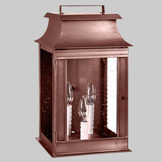Copper lantern with glass panels on a white background