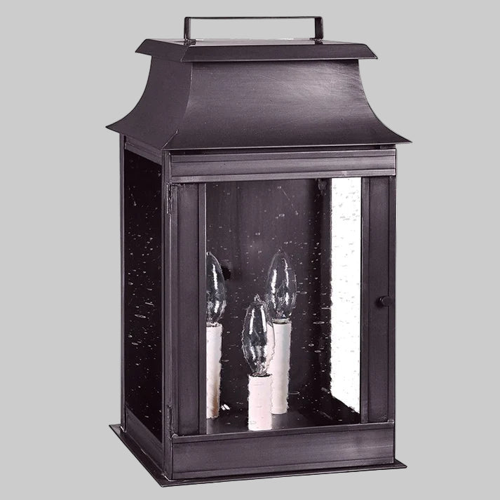 Black lantern with three visible light bulbs on a white background