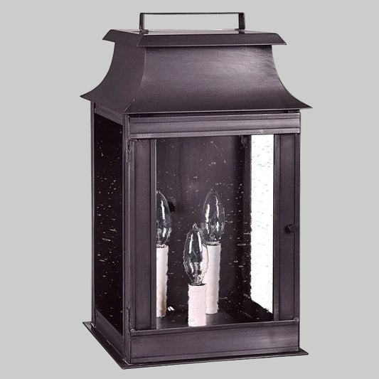 Black lantern with three visible light bulbs on a white background