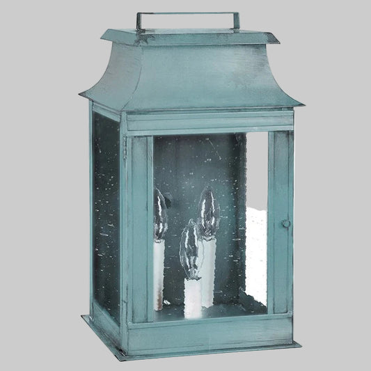 Teal lantern with glass panels on a white background